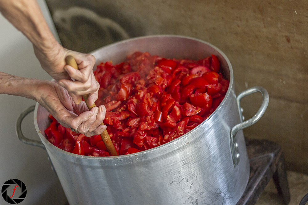 Stirring a cauldron of sauce!